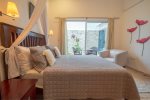 Master suite with queen bed and private patio access